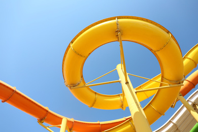 Photo of Colorful slides in water park, bottom view