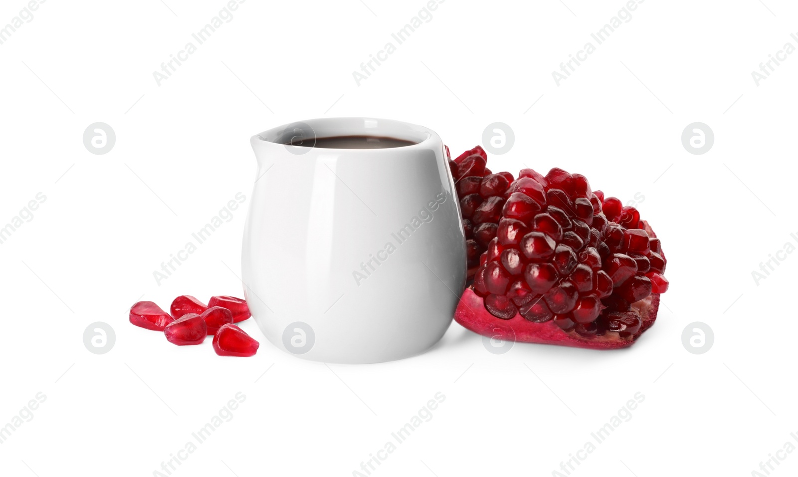 Photo of Tasty pomegranate sauce and fresh ripe fruit on white background