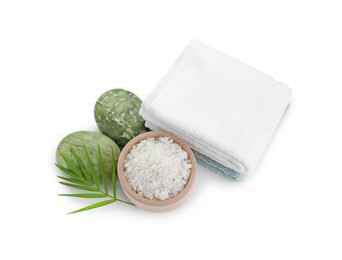 Photo of Bowl of sea salt, towels, massage stones and palm leaf isolated on white, above view. Spa treatment