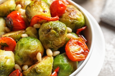 Bowl of salad with Brussels sprouts on table, closeup