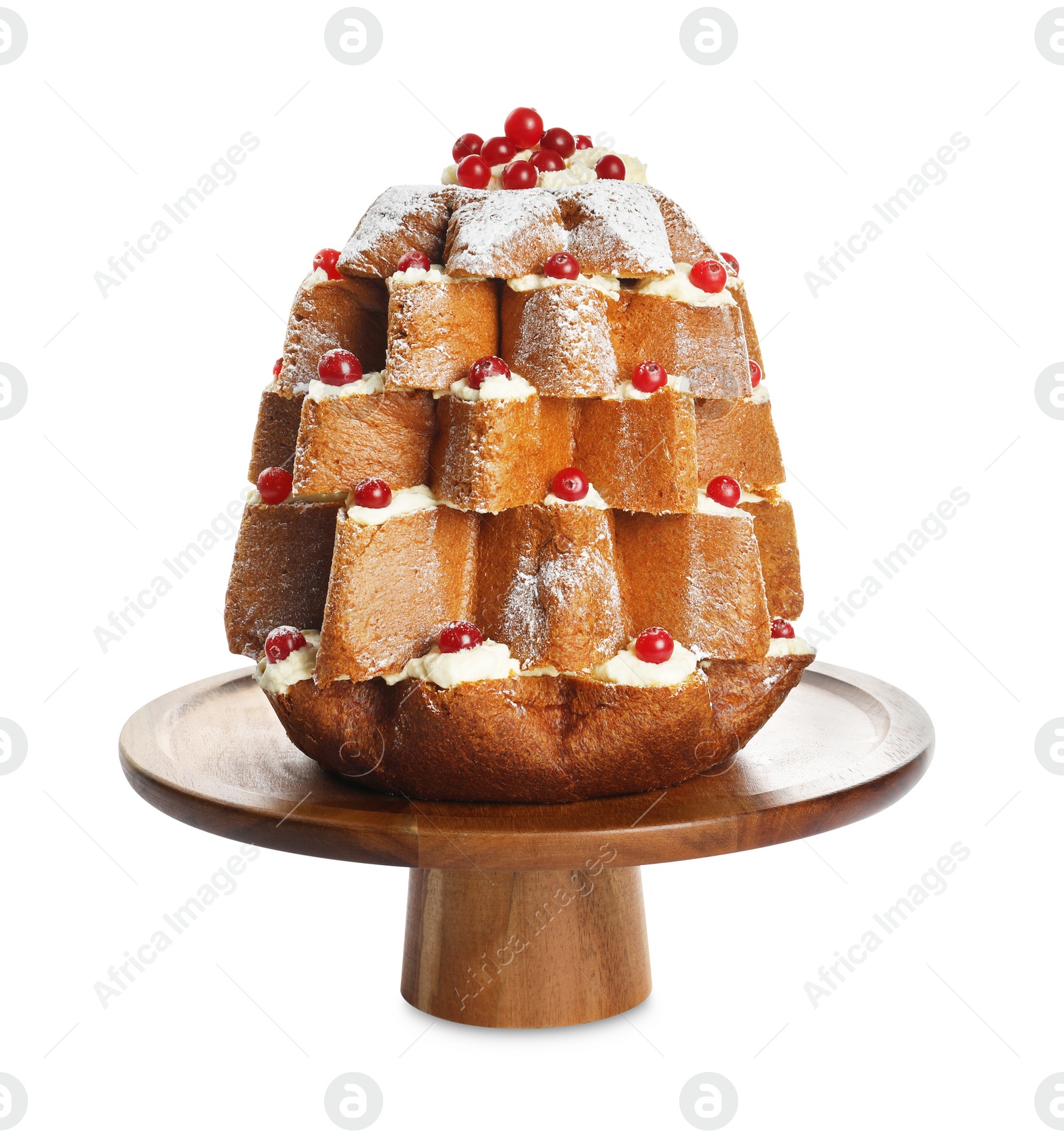 Photo of Delicious Pandoro Christmas tree cake decorated with powdered sugar and berries on white background