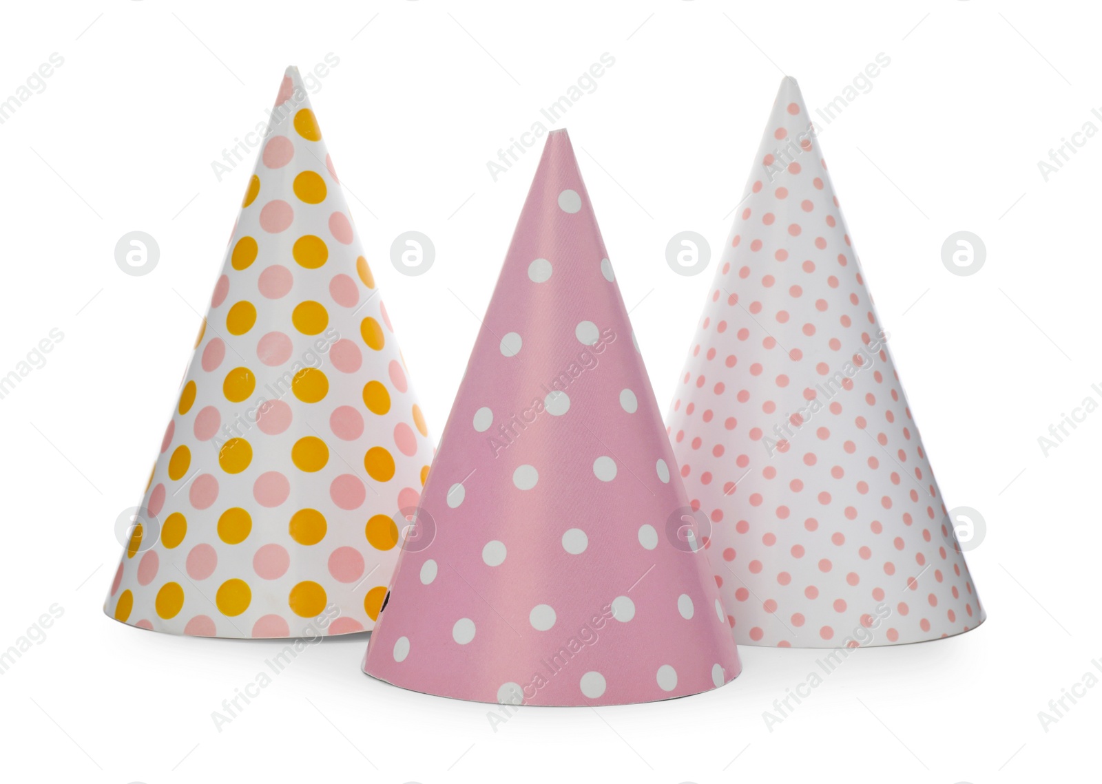 Photo of Bright party hats on white background. Festive accessory