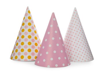 Photo of Bright party hats on white background. Festive accessory