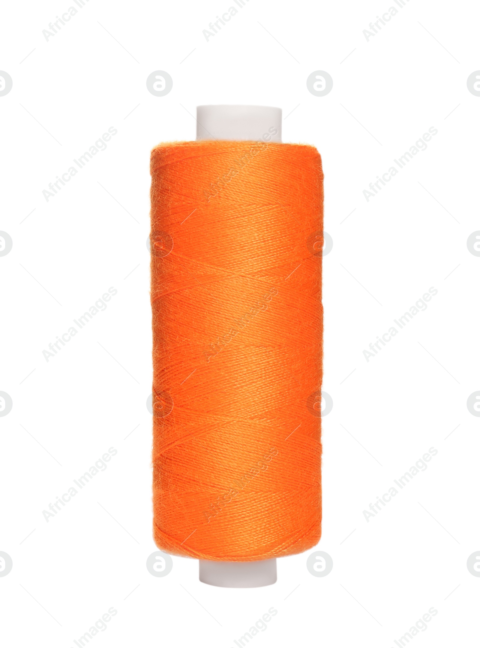 Photo of Spool of orange sewing thread isolated on white