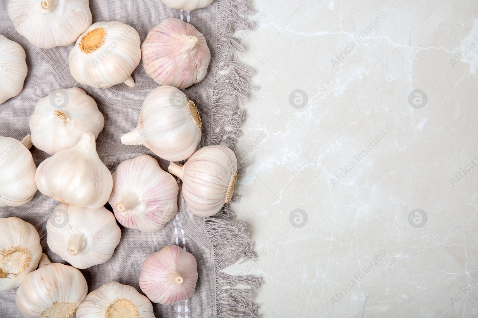 Photo of Flat lay composition with garlic on light background