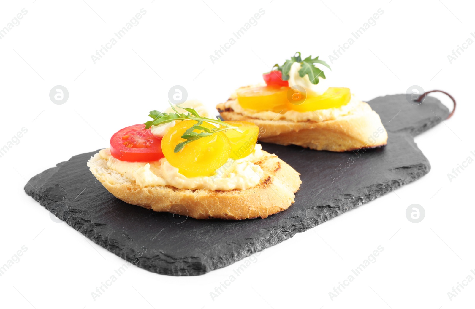 Photo of Slate board with delicious tomato bruschettas on white background