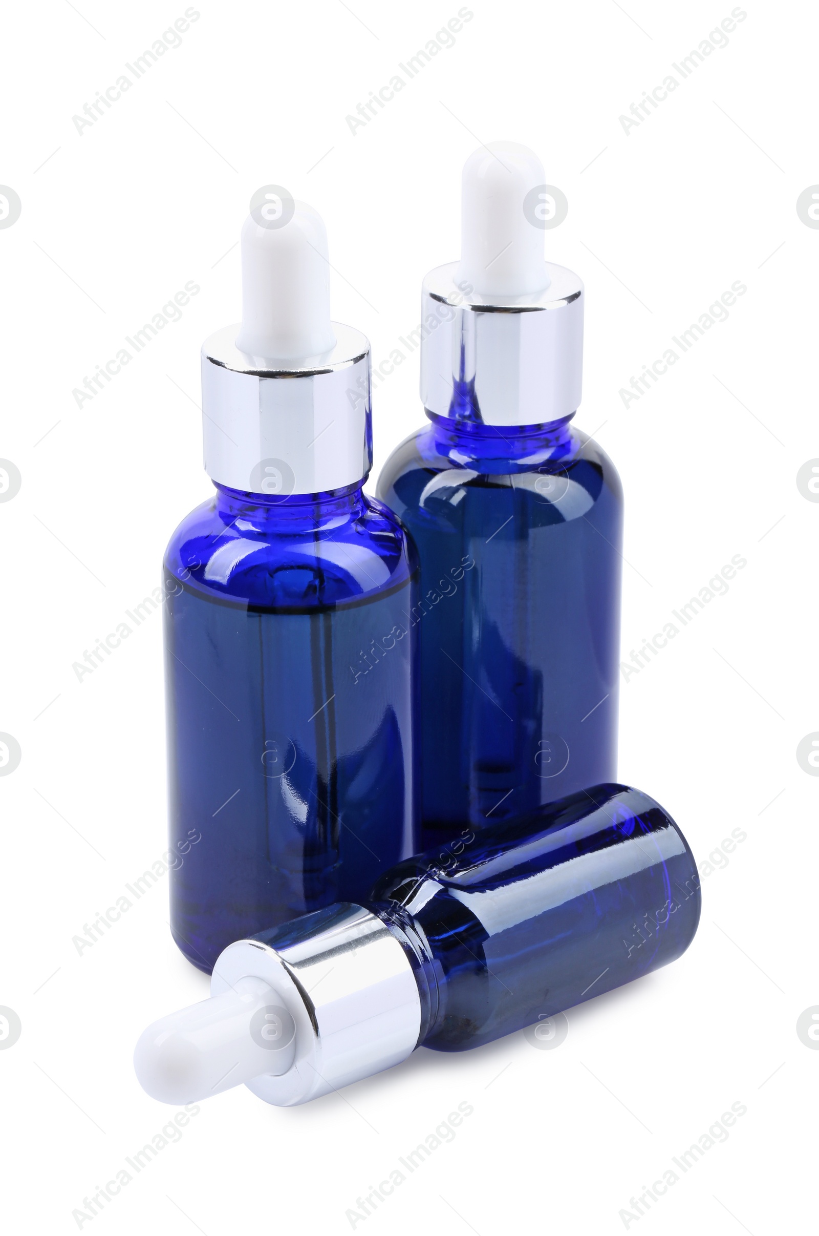 Photo of Blue bottles with tincture isolated on white