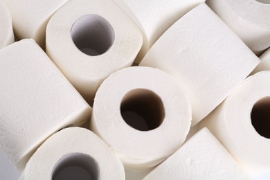 Photo of Many soft toilet paper rolls as background, above view