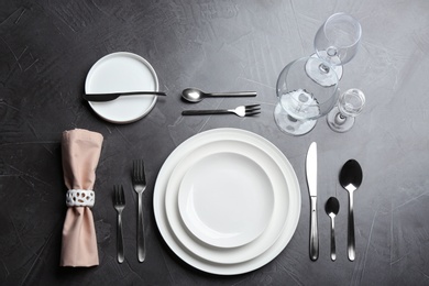 Elegant table setting on grey background, flat lay