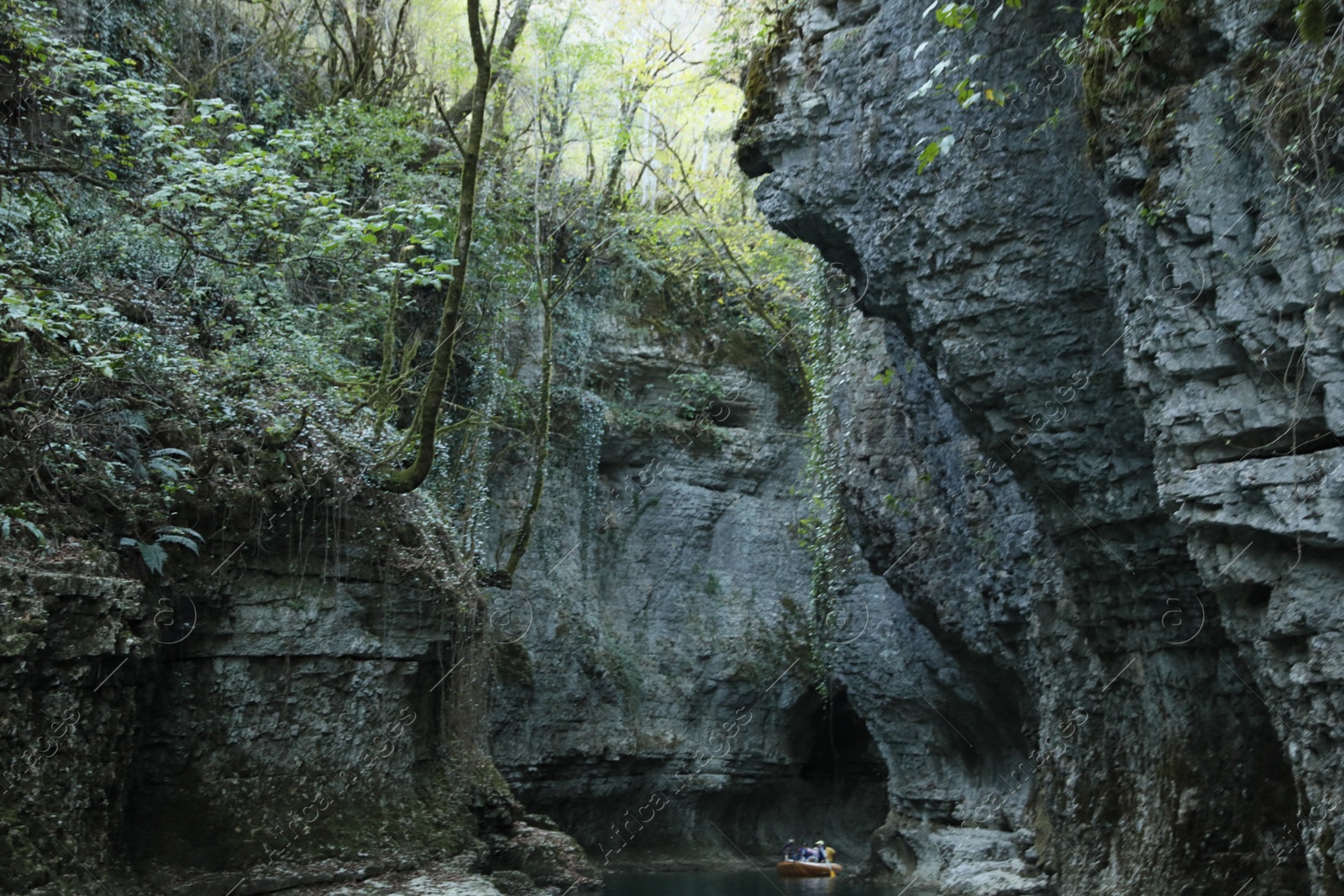 Photo of Picturesque view of clean river between cliffs outdoors