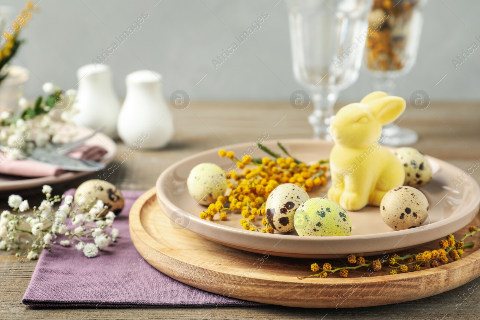 Photo of Festive Easter table setting with beautiful floral decor
