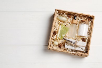 Spa gift set on white wooden table, top view. Space for text