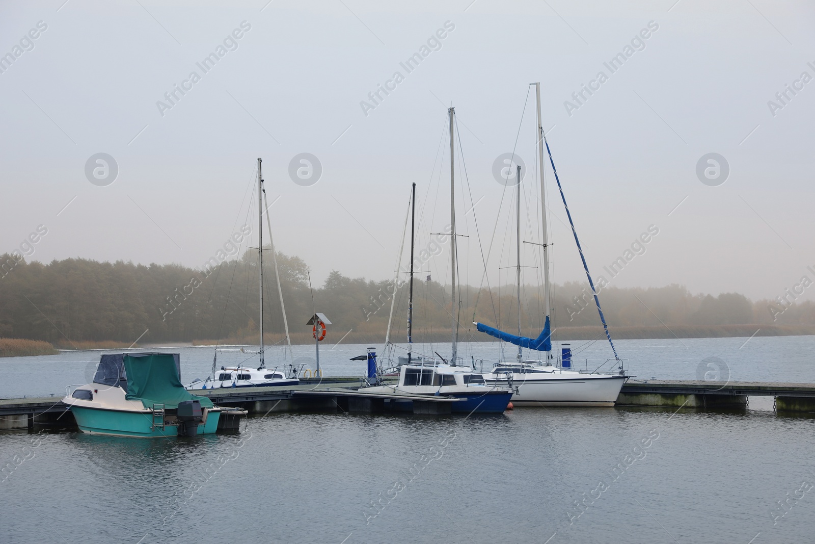 Photo of Picturesque view of pier with moored boats