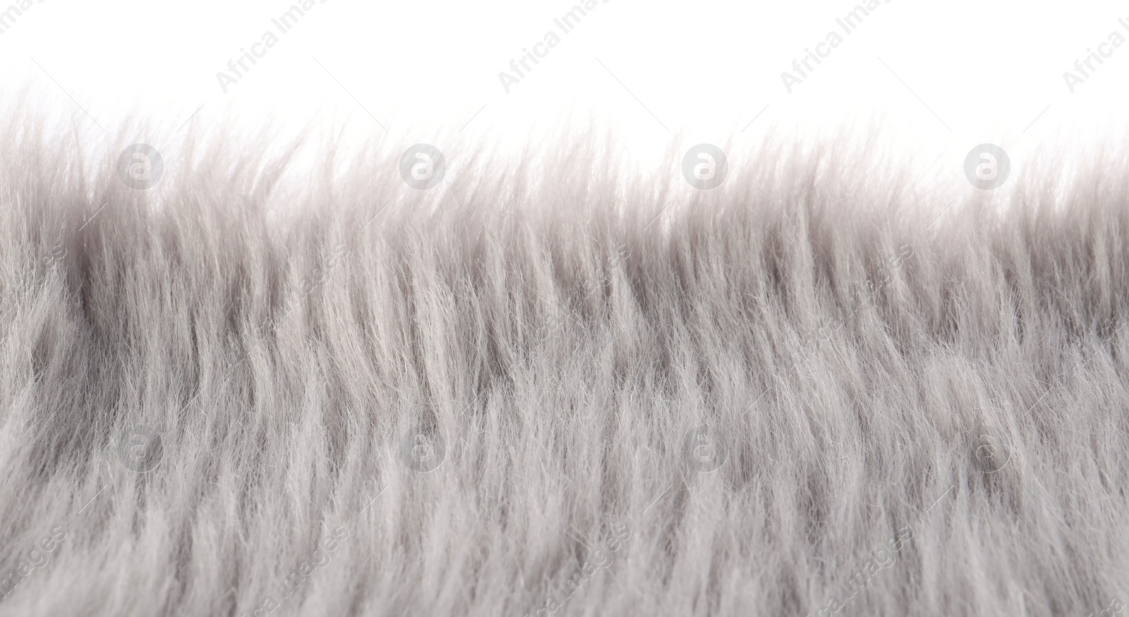 Photo of Soft grey faux fur isolated on white