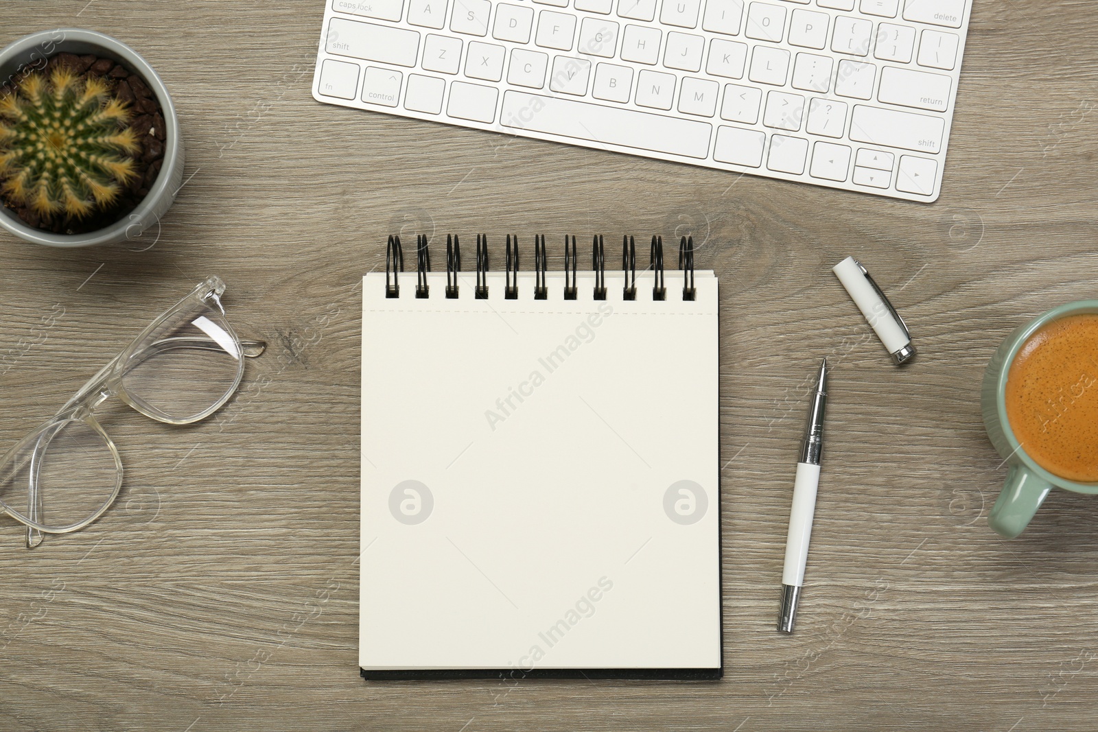 Photo of Flat lay composition with notebook on wooden table