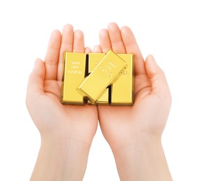 Photo of Woman holding shiny gold bars on white background, top view