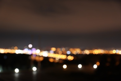 Photo of Blurred view of bridge with illumination in modern city at night