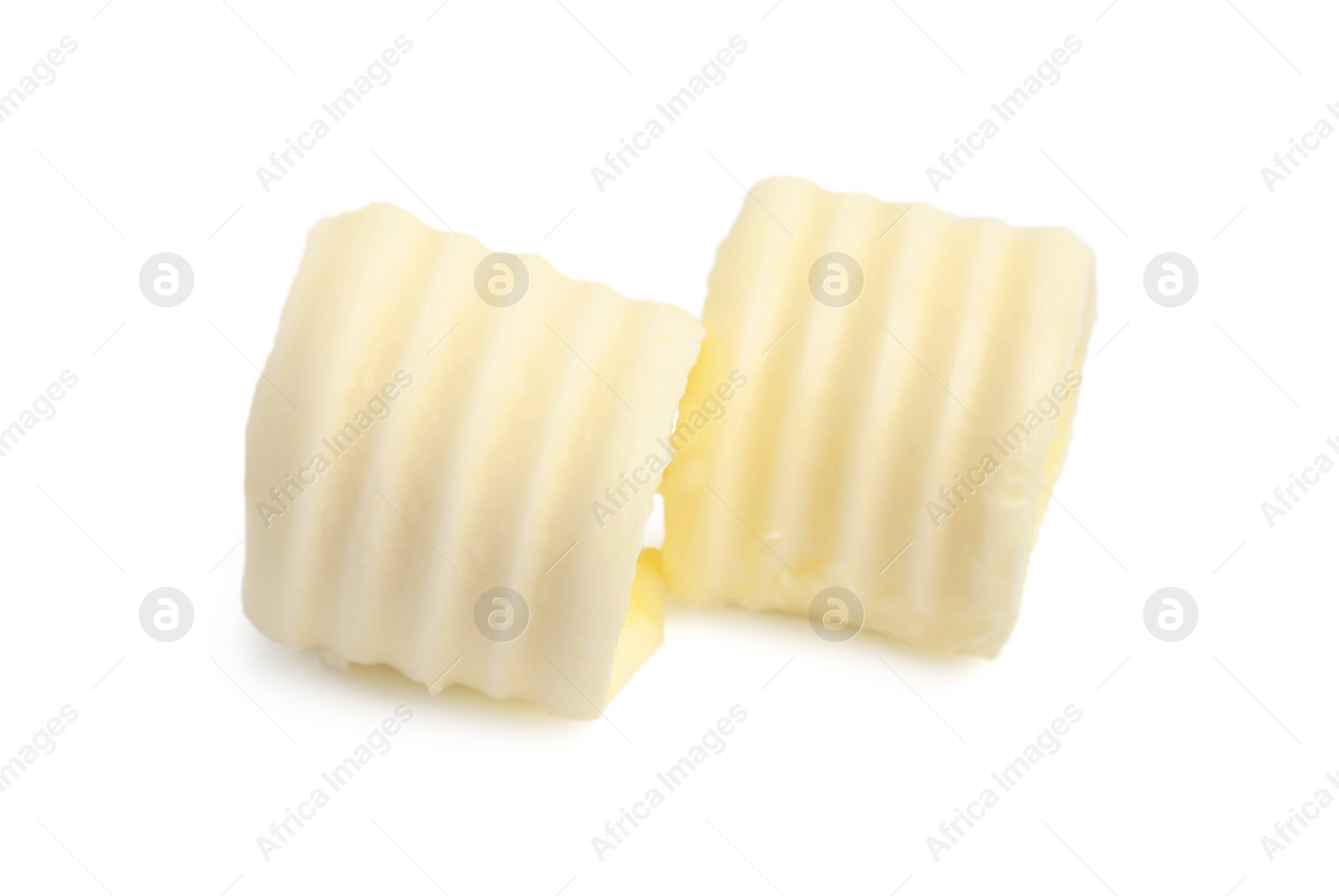 Photo of Two tasty butter curls isolated on white