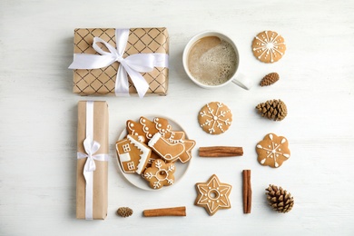 Flat lay composition with tasty homemade Christmas cookies on wooden table