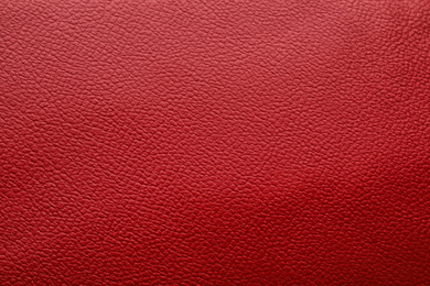 Photo of Texture of red leather as background, closeup