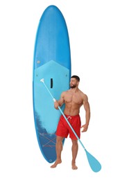 Happy man with blue SUP board and paddle on white background