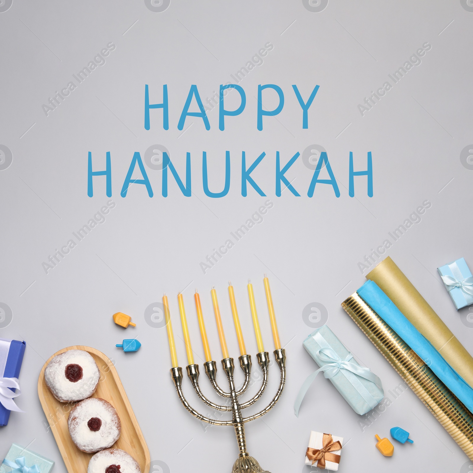 Image of Happy Hanukkah. Menorah, donuts, gifts and dreidels on light background, flat lay