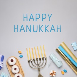 Image of Happy Hanukkah. Menorah, donuts, gifts and dreidels on light background, flat lay