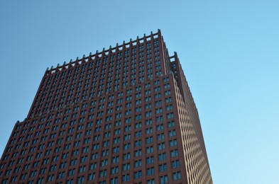 Photo of Exterior of beautiful modern building against blue sky, low angle view