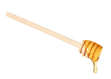 Photo of Natural honey dripping from dipper on white background