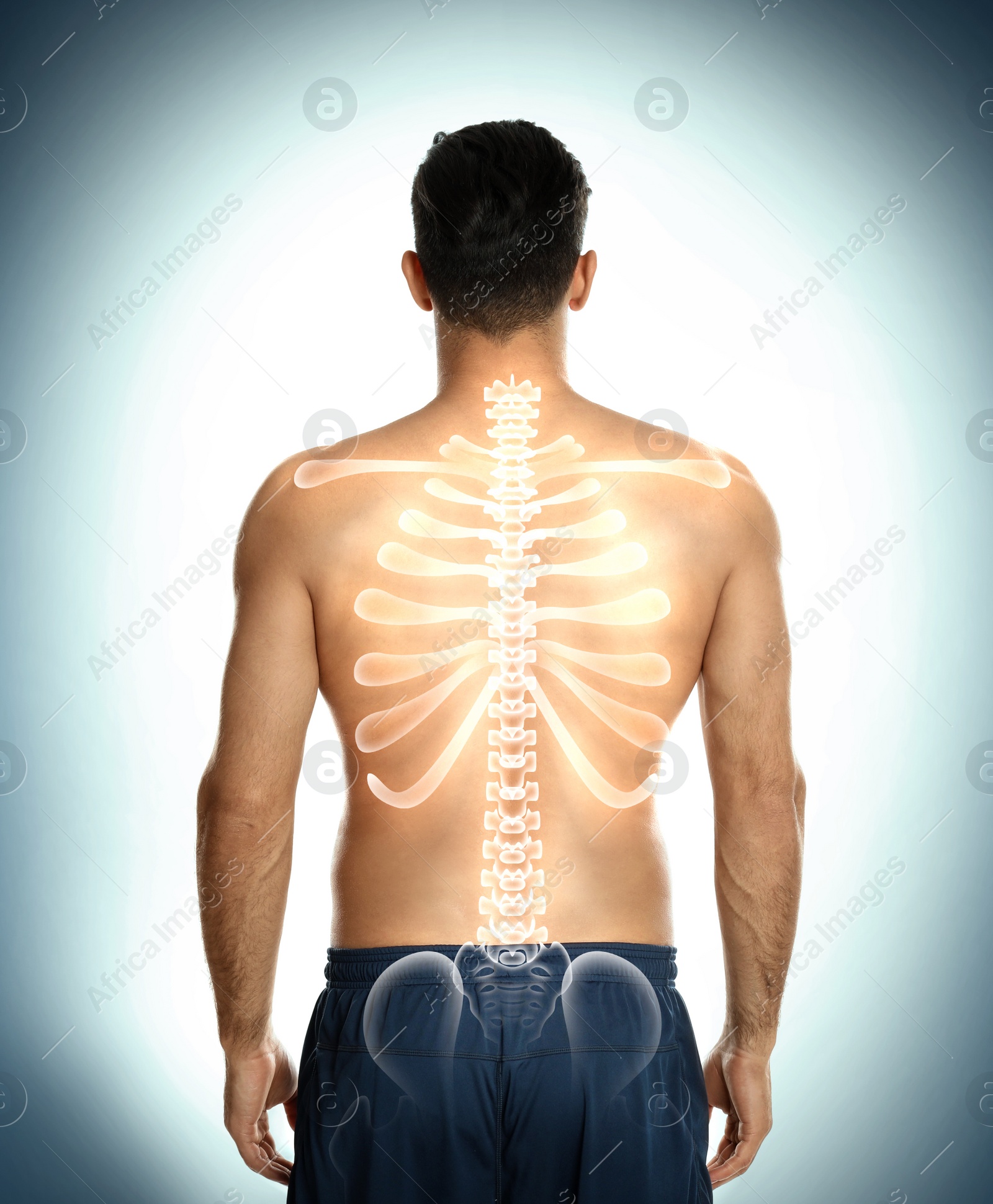 Image of Man with healthy back on light background. Spine pain prevention