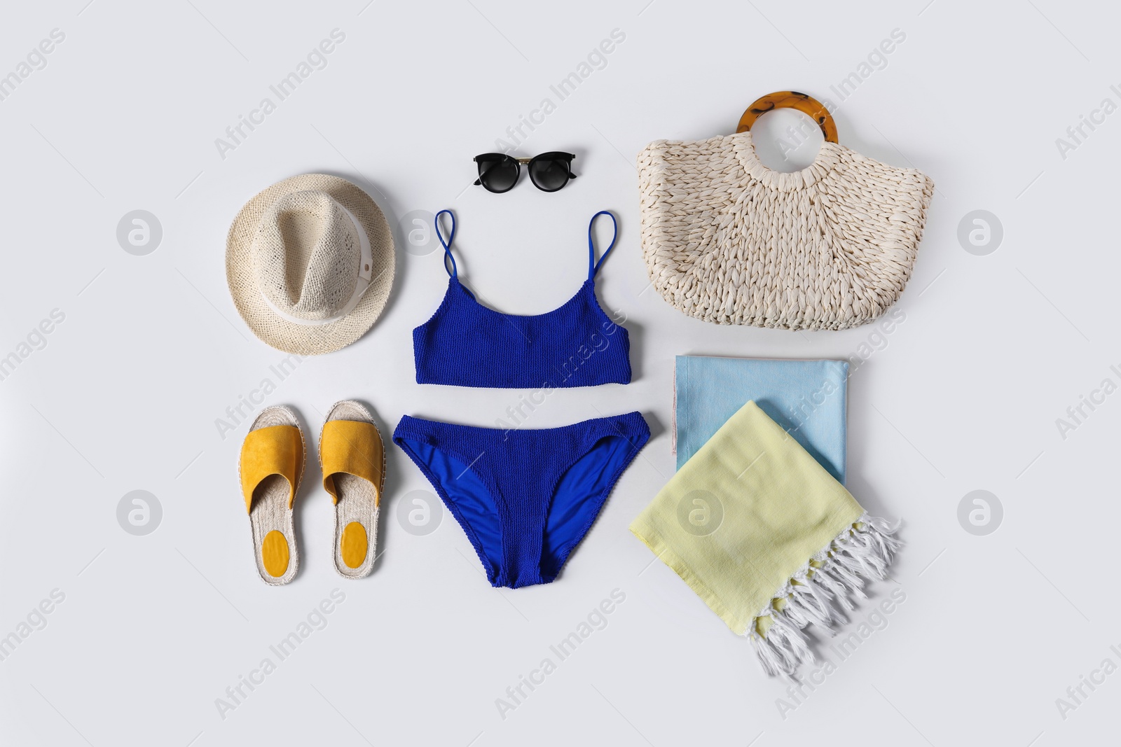 Photo of Flat lay composition with beach accessories on white background