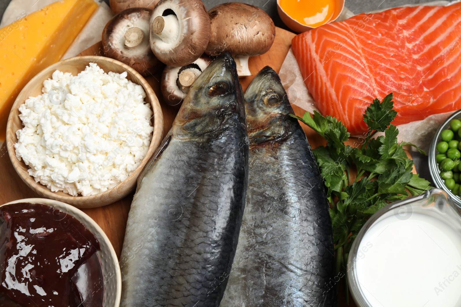 Photo of Fresh products rich in vitamin D on table, closeup