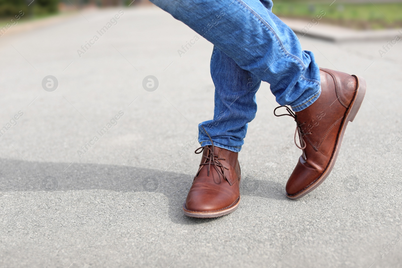 Photo of Man in elegant leather shoes outdoors, closeup