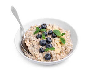 Photo of Tasty oatmeal with blueberries, mint and almond flakes in bowl isolated on white