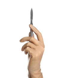 Doctor in medical glove holding surgery scalpel on white background