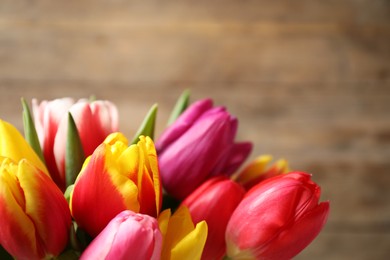Photo of Beautiful spring tulips on blurred background, closeup