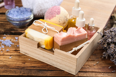 Natural handmade soap bars in box on wooden background