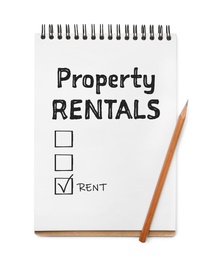 Notebook with text Property Rentals, check mark and boxes on white background