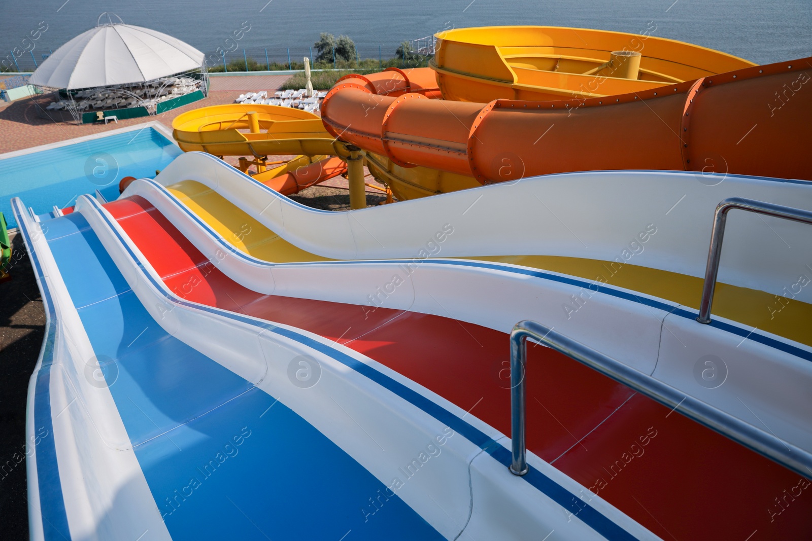 Photo of Colorful slides in water park on sunny day