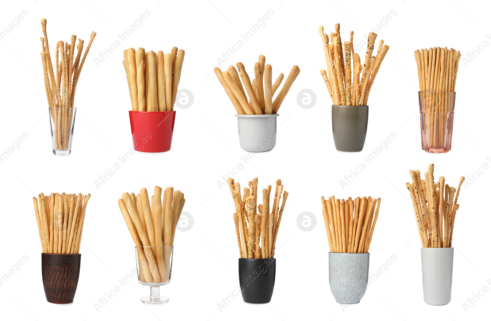 Image of Set with delicious crispy grissini sticks on white background