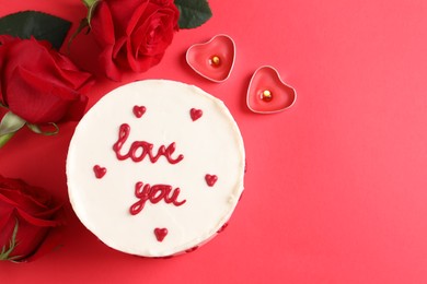 Photo of Bento cake with text Love You, roses, candles and space for text on red table, flat lay. St. Valentine's day surprise