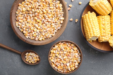 Photo of Flat lay composition with dried corn kernels on grey background