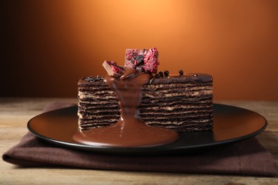 Photo of Tasty sweet chocolate cake on table, closeup