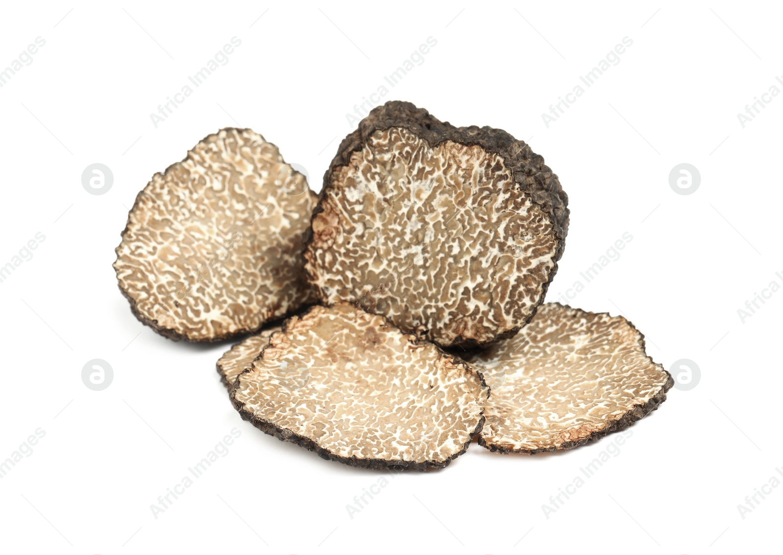 Photo of Cut fresh black truffle isolated on white