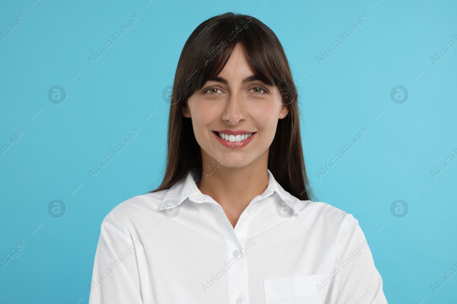 Photo of Portrait of happy secretary on light blue background