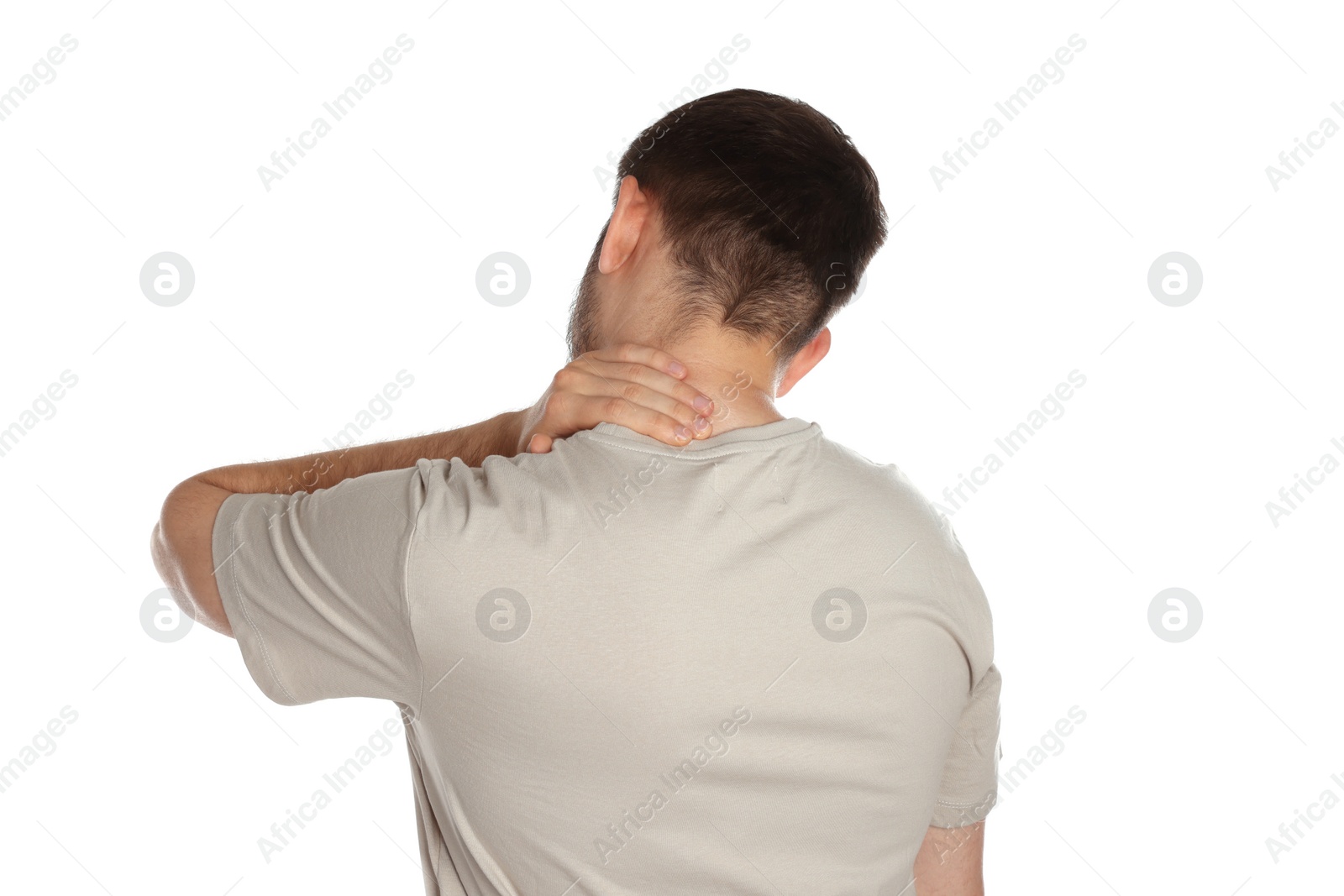 Photo of Man suffering from neck pain on white background, back view