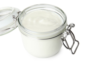 Glass jar with creamy yogurt on white background