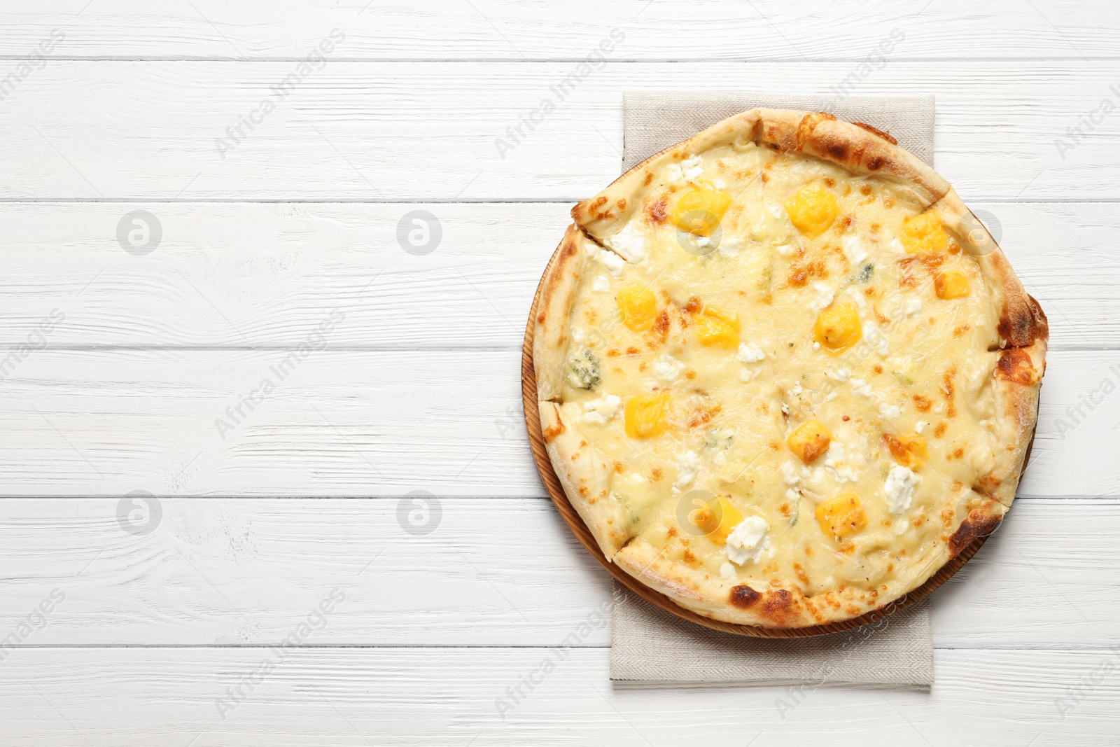 Photo of Hot cheese pizza Margherita on white wooden background, top view. Space for text