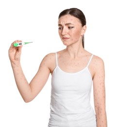 Woman with rash holding thermometer on white background. Monkeypox virus