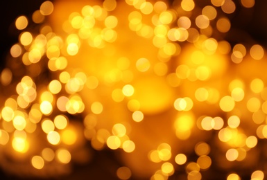 Gold glitter with bokeh effect on dark background